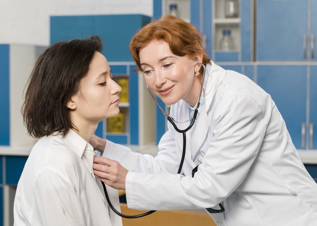 doctor consulting patient with stethoscope